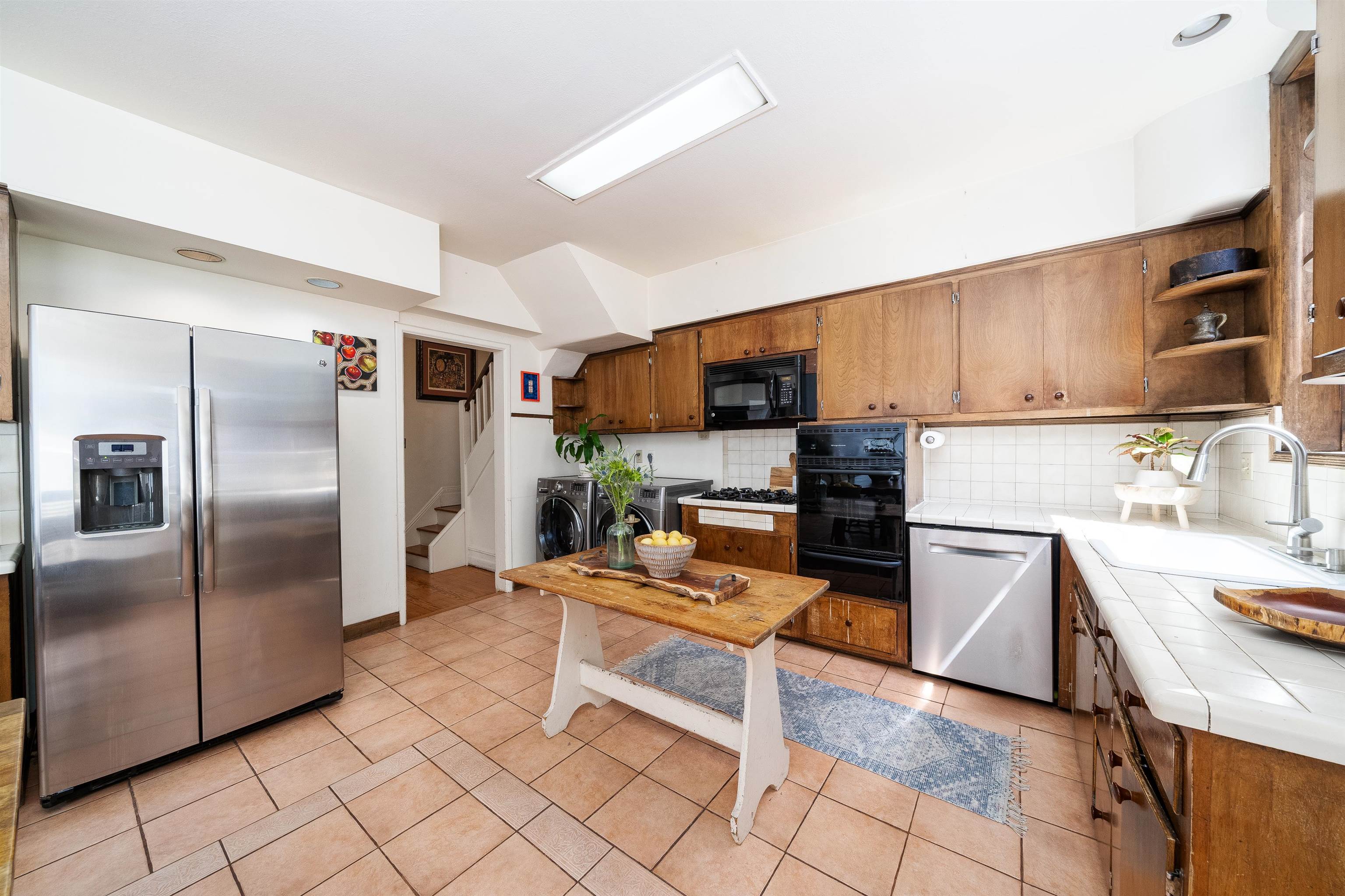 901 Castle Point Terrace Hoboken, NJ 07030 - Photo 14 of 40 a kitchen with granite countertop a refrigerator and a stove top oven
