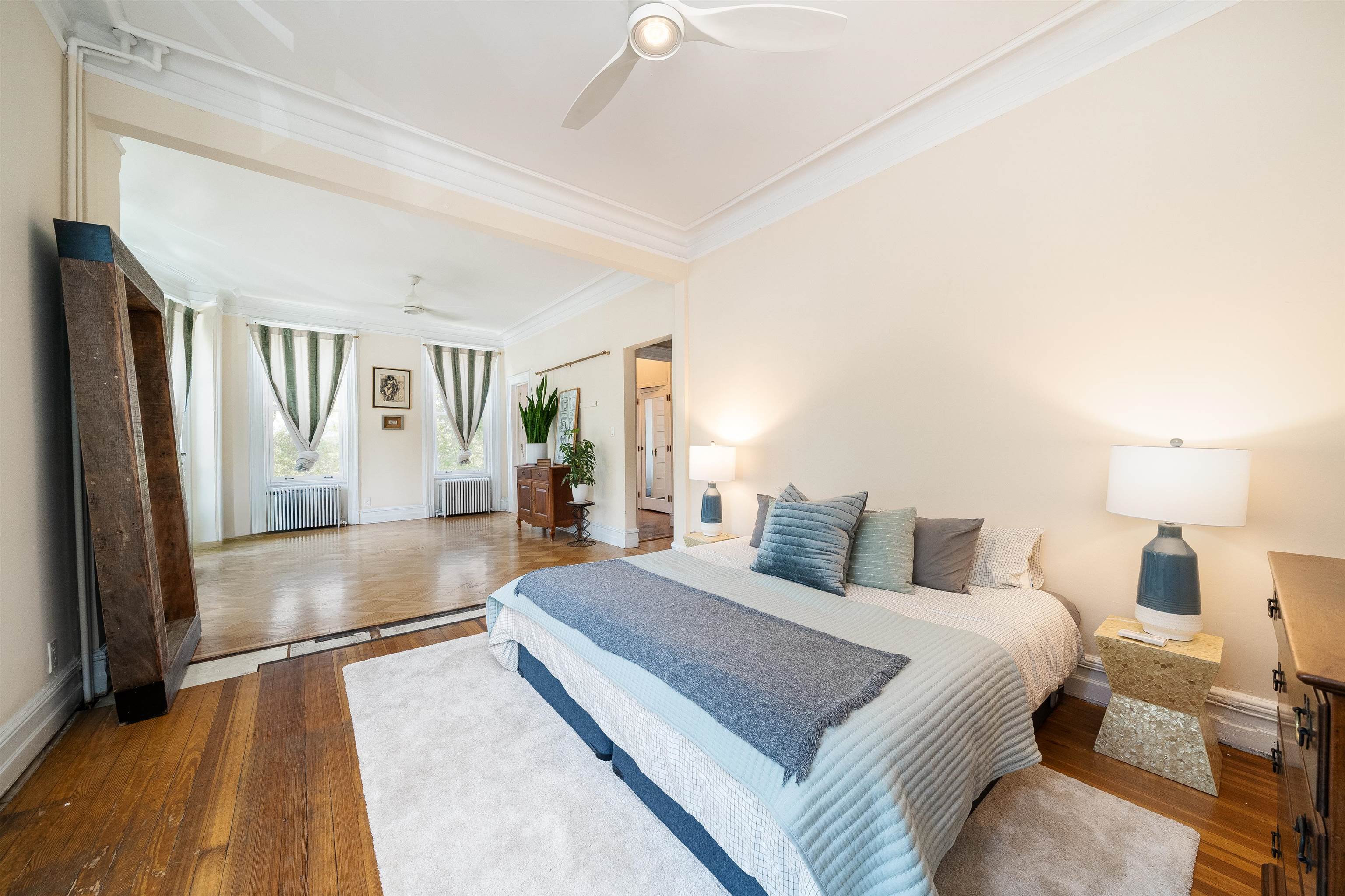 901 Castle Point Terrace Hoboken, NJ 07030 - Photo 17 of 40 a bedroom with a large bed and a chandelier