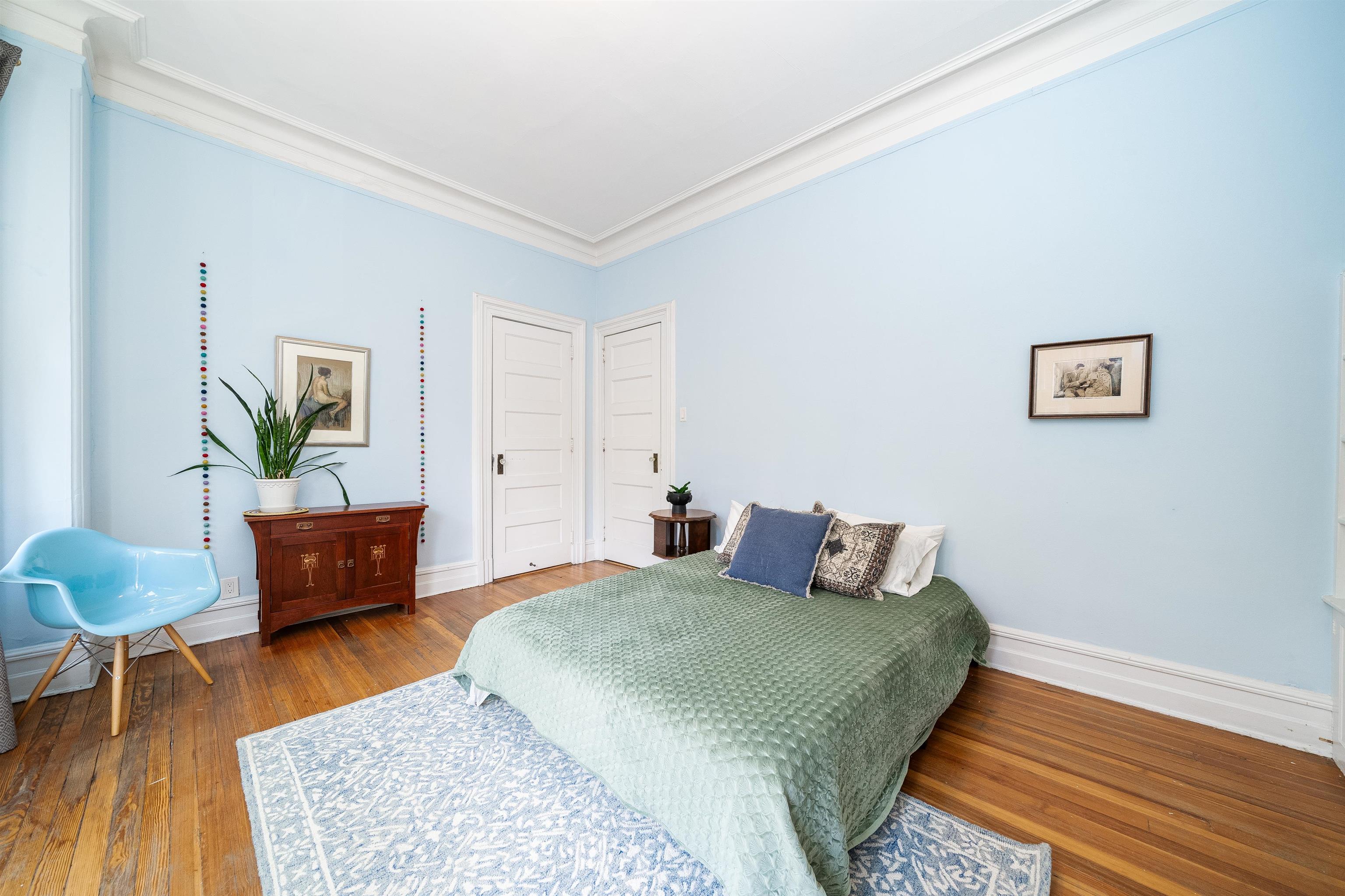 901 Castle Point Terrace Hoboken, NJ 07030 - Photo 28 of 40 a bedroom with a bed and a wooden floor