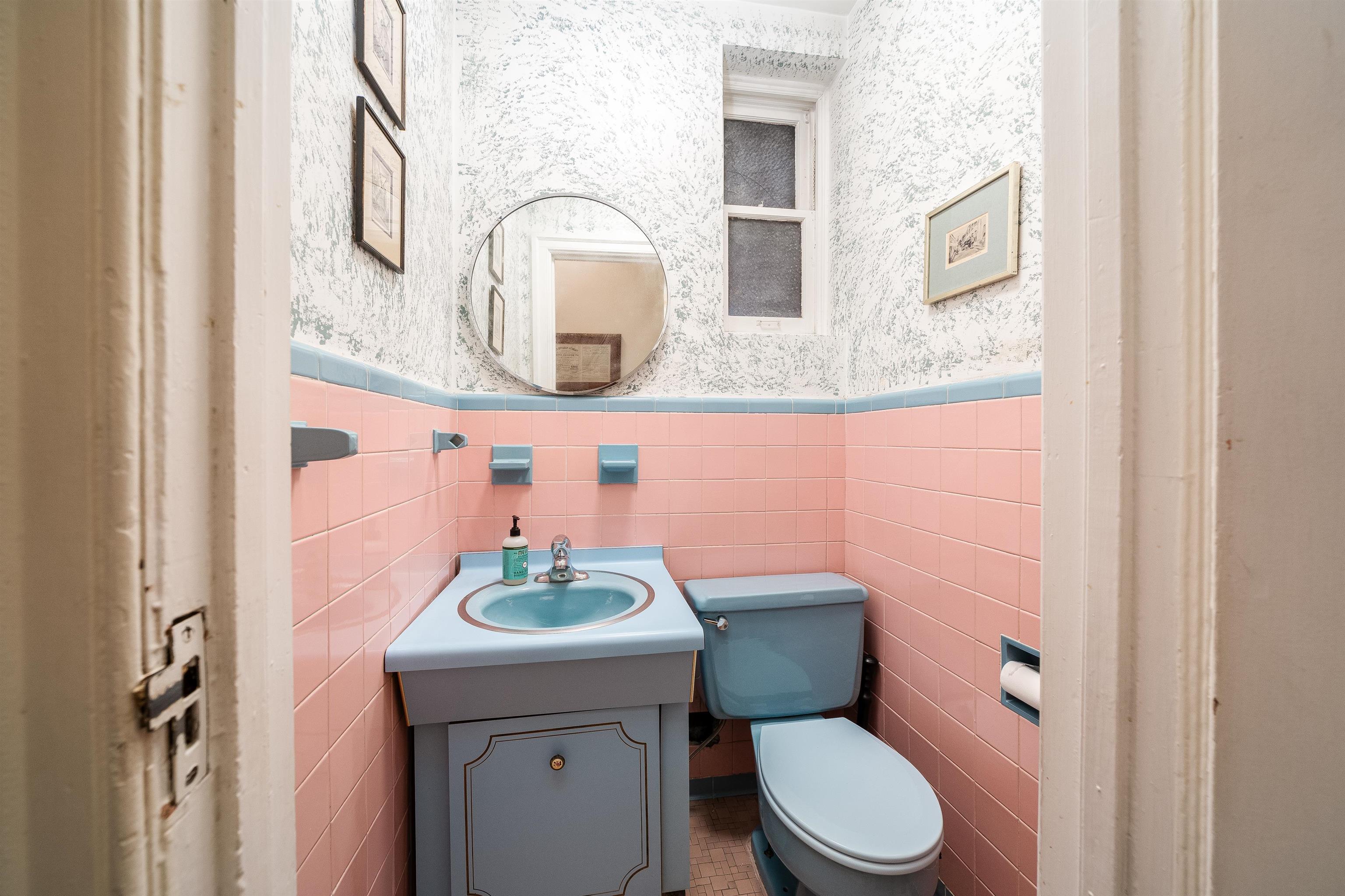 901 Castle Point Terrace Hoboken, NJ 07030 - Photo 32 of 40 a bathroom with a granite countertop toilet sink and mirror