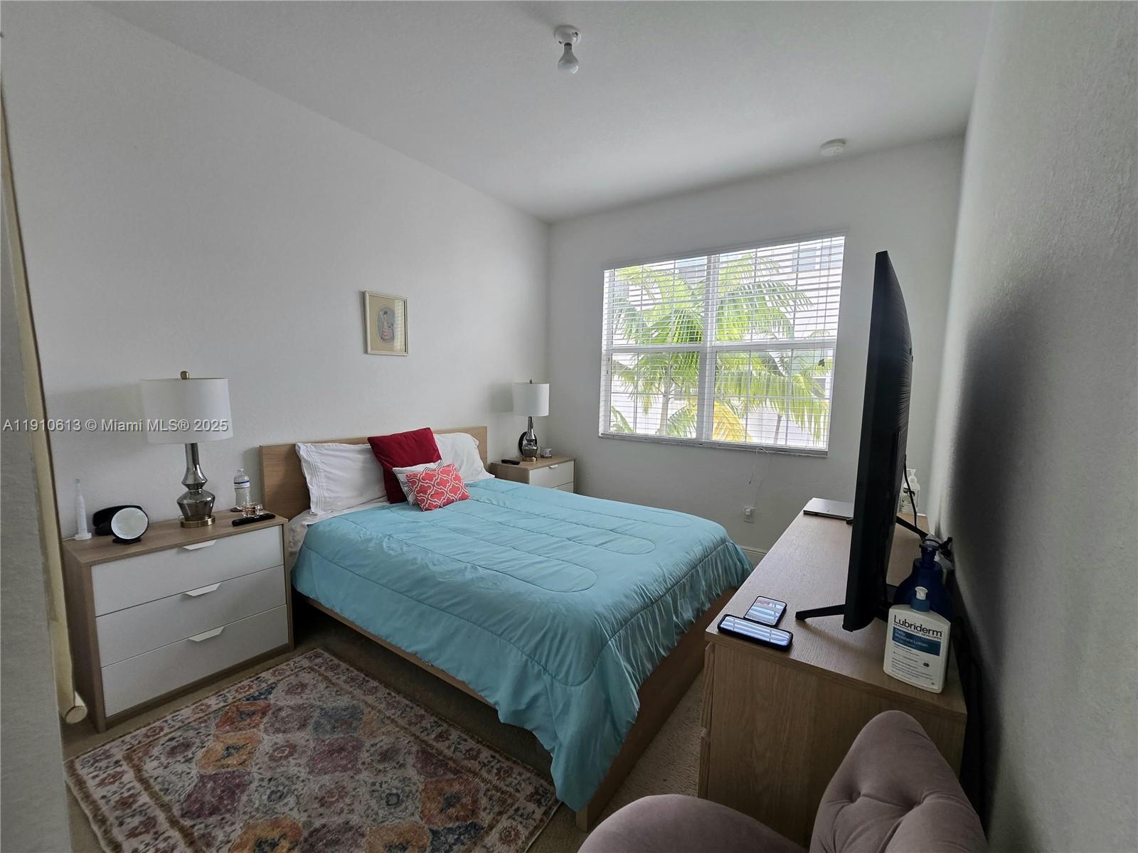 11938 Southwest 26th Court Miramar, FL 33025 - Photo 22 of 62 a bedroom with a bed window and a dresser