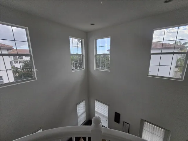 a bedroom with a bed and a television