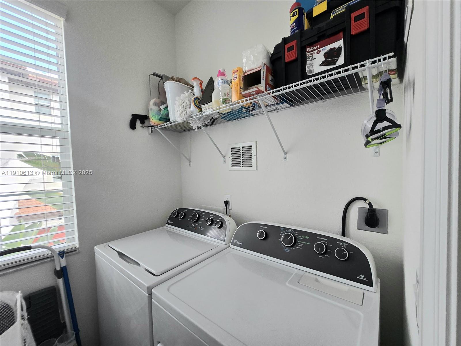 11938 Southwest 26th Court Miramar, FL 33025 - Photo 38 of 62 a utility room with dryer and washer