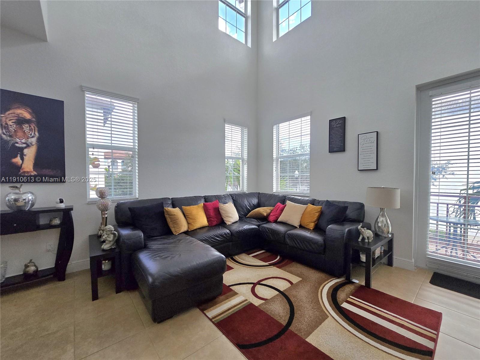 11938 Southwest 26th Court Miramar, FL 33025 - Photo 6 of 62 a living room with furniture and a window