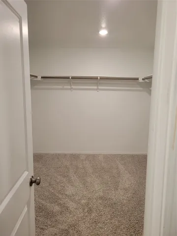 an empty room with a empty space and windows