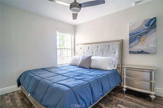 a bedroom with a bed and window