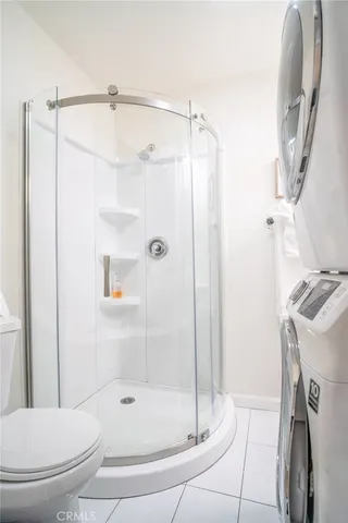 a bathroom with a shower and a toilet