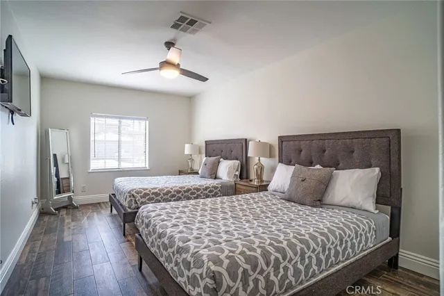 a bedroom with bed and window