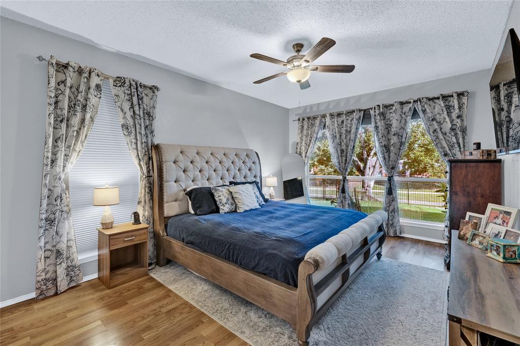 2409 Loon Lake Road Denton, TX 76210 - Photo 11 of 30 Unwind in the cozy primary suite, designed for peaceful and restful evenings.