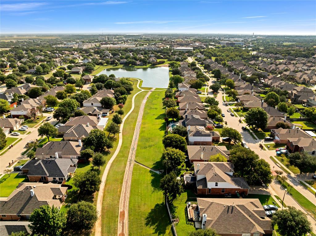 2409 Loon Lake Road Denton, TX 76210 - Photo 28 of 30 Aerial view of the neighborhood, community lake, and greenbelt.