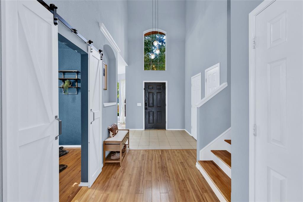 2409 Loon Lake Road Denton, TX 76210 - Photo 3 of 30 Grand entry area with impressive, soaring ceilings that immediately create a sense of spaciousness.
