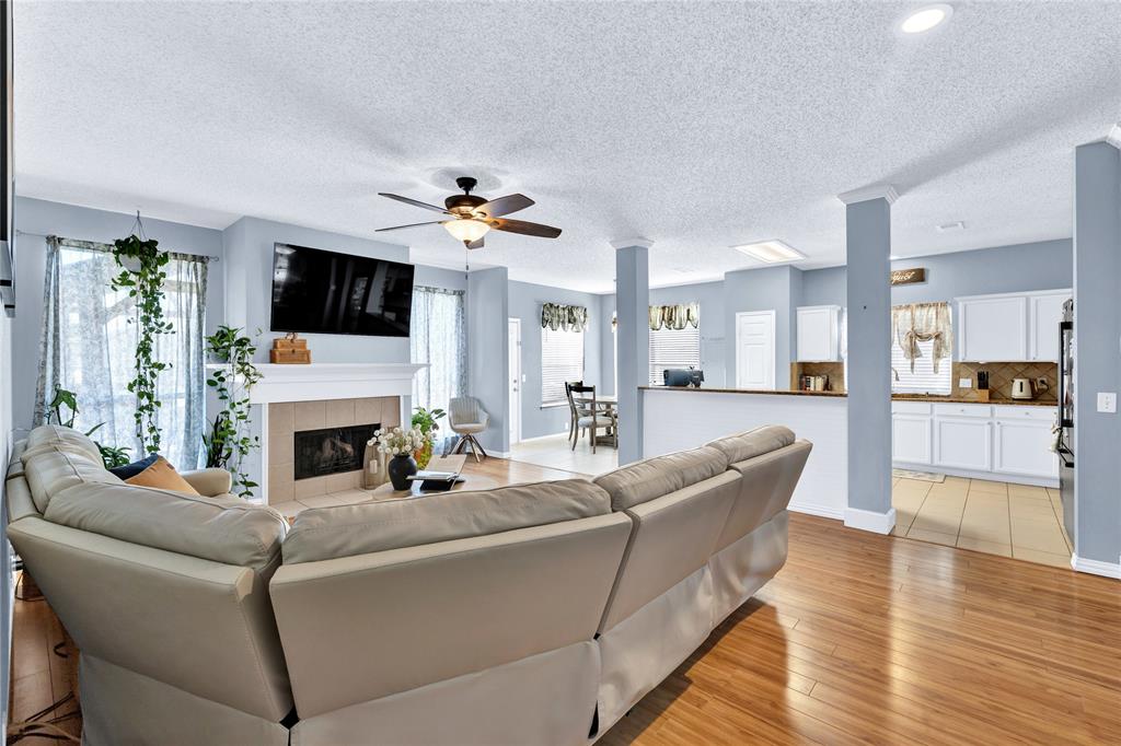 2409 Loon Lake Road Denton, TX 76210 - Photo 6 of 30 Living and kitchen spaces connect effortlessly for functionality and everyday living.