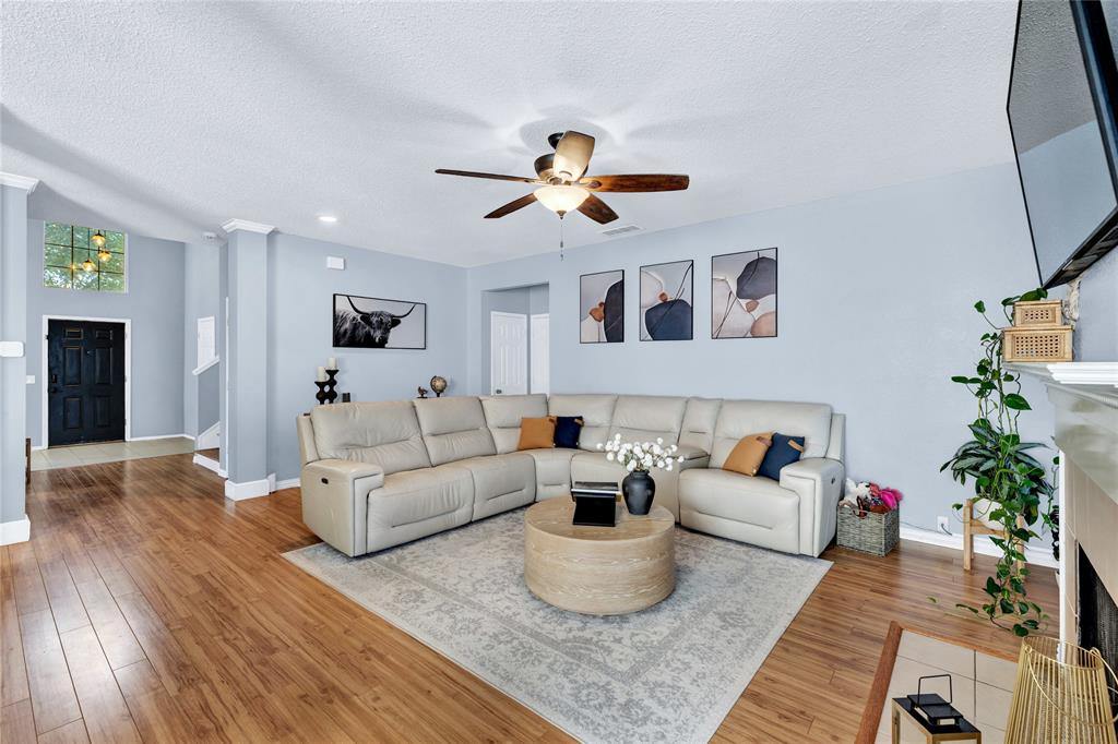 2409 Loon Lake Road Denton, TX 76210 - Photo 7 of 30 Spacious living space that is perfect for family gatherings and cozy nights by the fire.