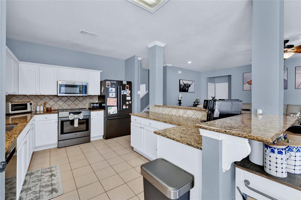 2409 Loon Lake Road Denton, TX 76210 - Photo 9 of 30 Beautifully designed kitchen, perfect for creating family meals and holiday feasts.