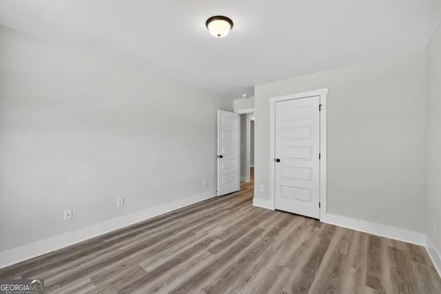 a view of room with window and entryway