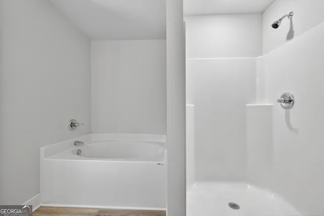 a bathroom with a granite countertop sink and a vanity