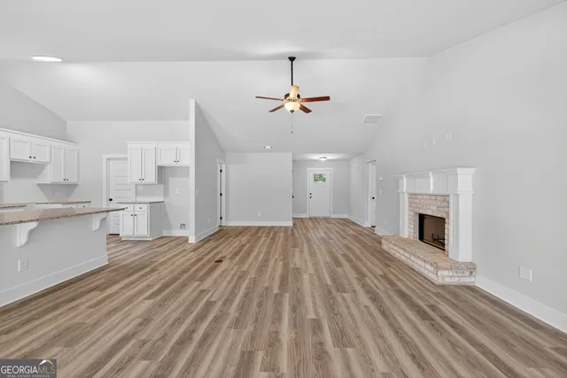 a view of a kitchen with microwave and cabinets