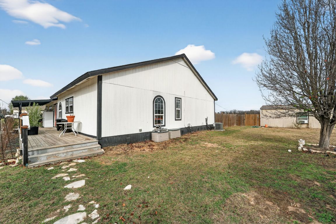 174 Monroe Lane Elgin, TX 78621 - Photo 19 of 21 a view of a white house with a yard