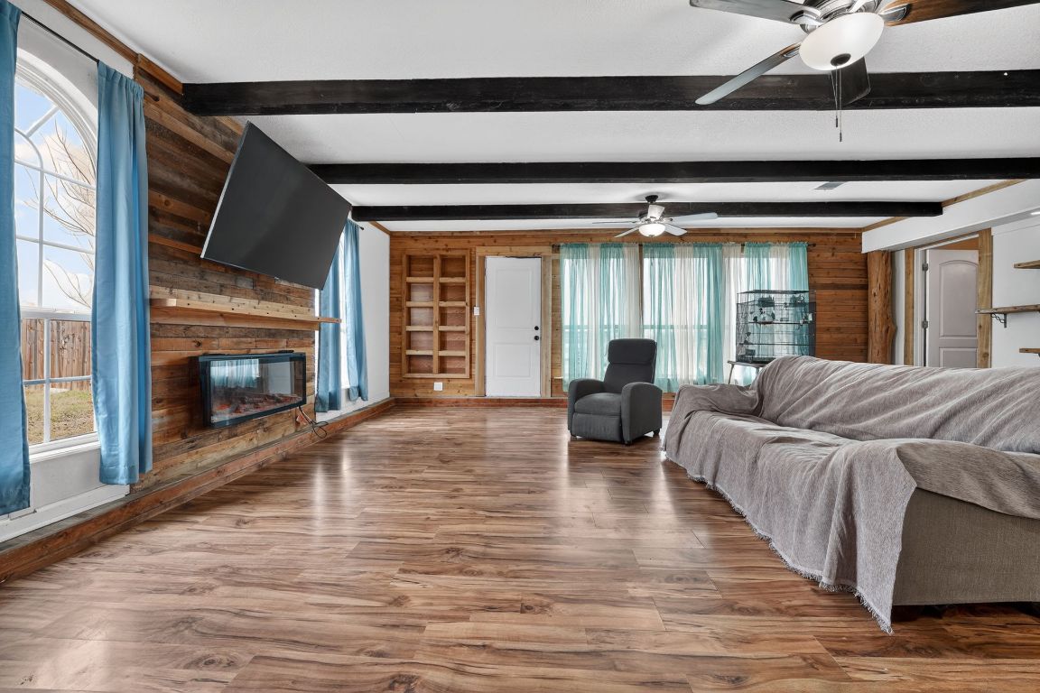 174 Monroe Lane Elgin, TX 78621 - Photo 6 of 21 a living room with furniture and a fireplace