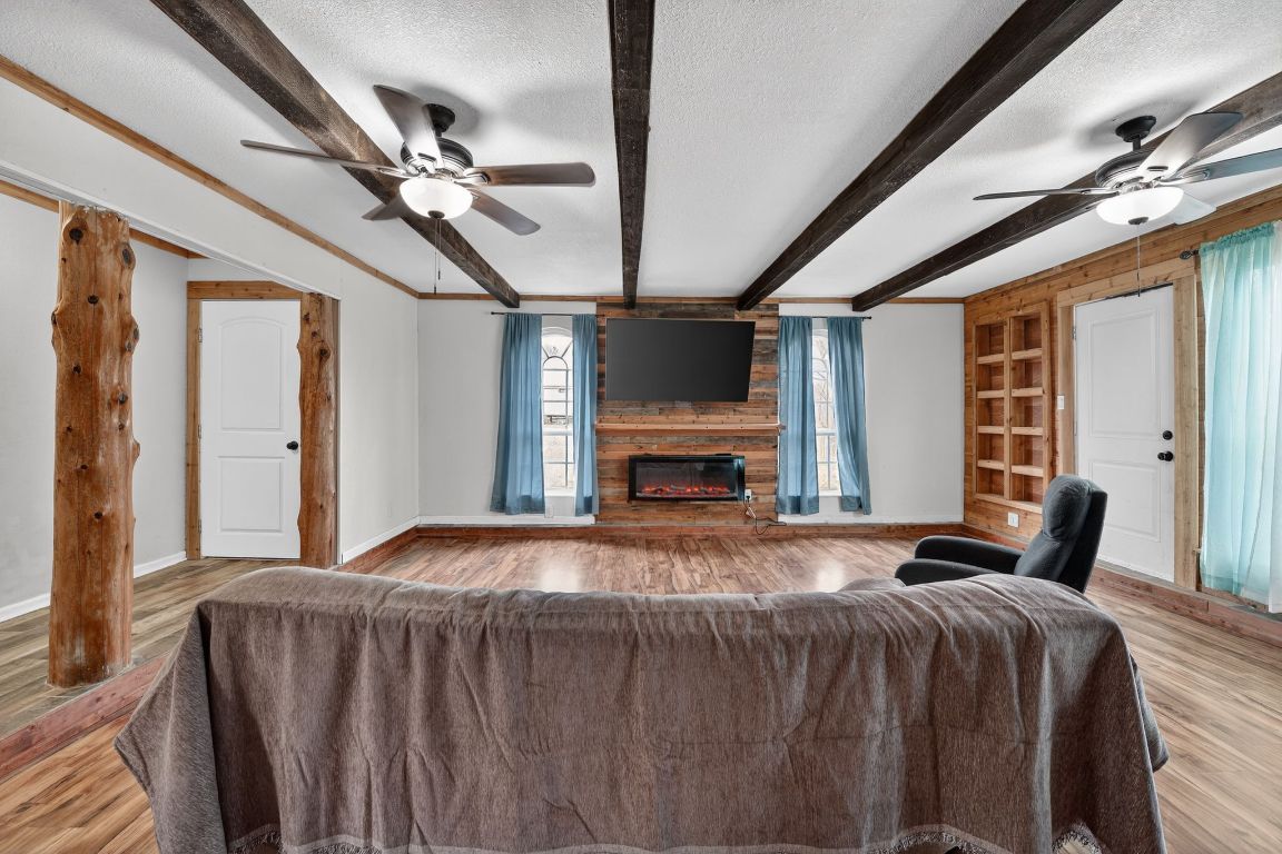 174 Monroe Lane Elgin, TX 78621 - Photo 7 of 21 a bedroom with a bed window and flat screen tv