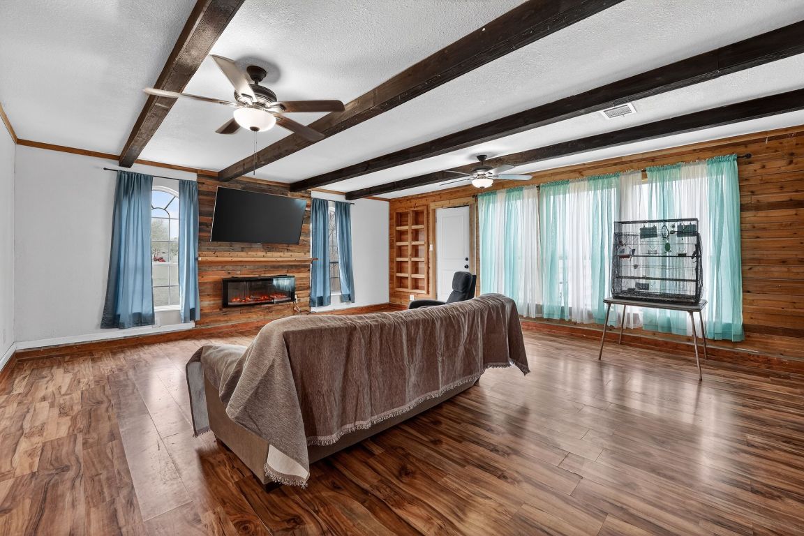 174 Monroe Lane Elgin, TX 78621 - Photo 8 of 21 a living room with furniture and a fireplace