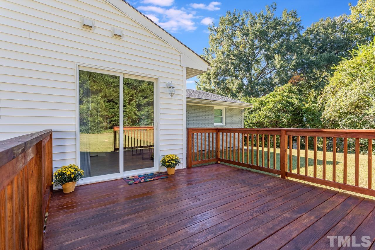 5104 Newcastle Road Raleigh, NC 27606 - Photo 22 of 23 a view of a house with a balcony