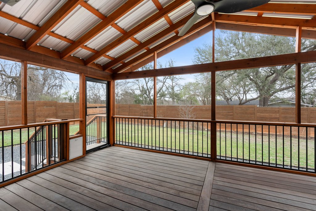 3404 Touchstone Street Austin, TX 78723 - Photo 24 of 33 Unfurnished sunroom featuring a deck, a ceiling fan, and healthy amount of natural light