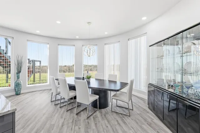 a spacious bathroom with double vanity a mirror a bathtub and shower