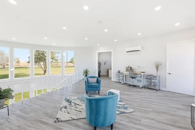 a bedroom with a bed and a night stand