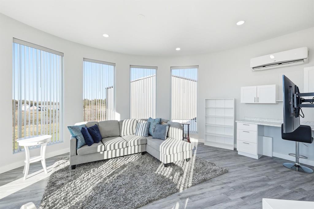 145 ROCK Court Decatur, TX 76234 - Photo 26 of 40 a living room with furniture and a wooden floor