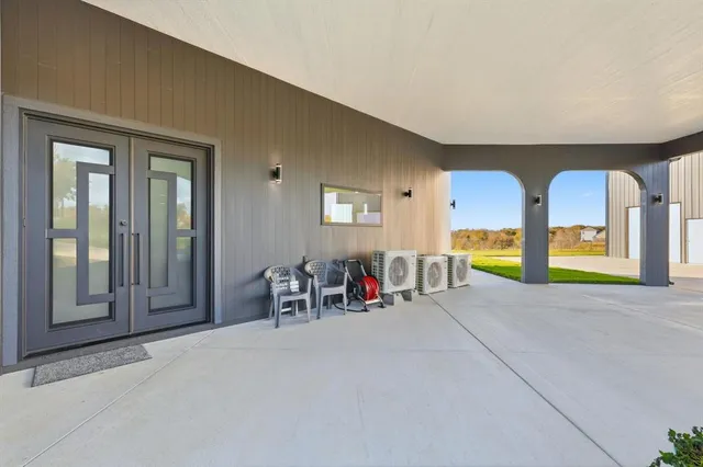 a view of an entryway with wooden floor