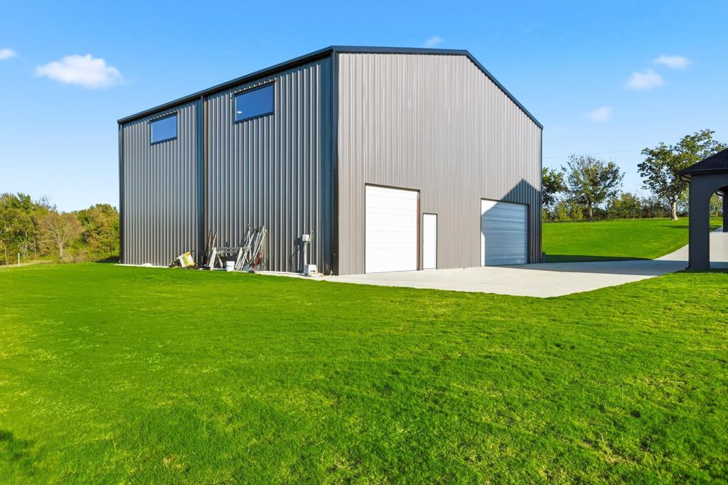 145 ROCK Court Decatur, TX 76234 - Photo 31 of 40 a view of a back yard of the house