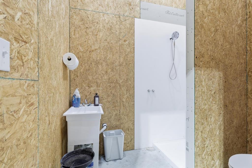 145 ROCK Court Decatur, TX 76234 - Photo 35 of 40 a bathroom with a sink toilet and shower