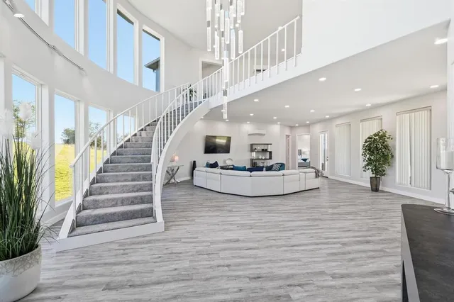 a living room with fireplace furniture and a flat screen tv