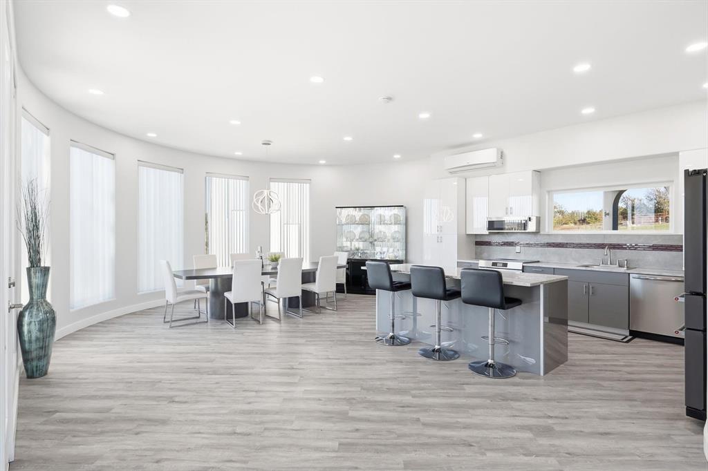 145 ROCK Court Decatur, TX 76234 - Photo 7 of 40 a living room with lots of furniture and kitchen view