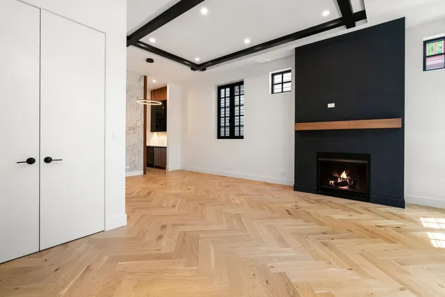 a view of an empty room with a fireplace