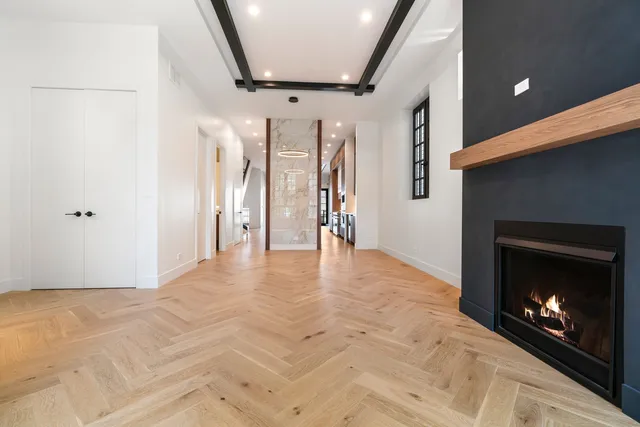 a view of empty room with a fireplace