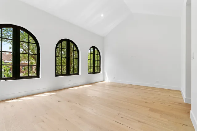 a view of empty room with large windows