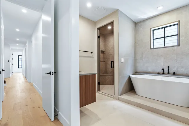 a bathroom with a bathtub and a sink