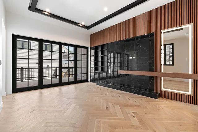 a view of an empty room with a fireplace