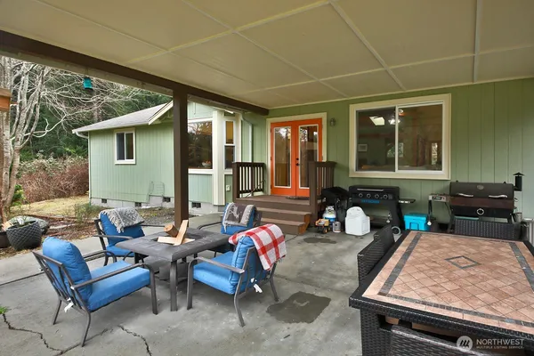 a view of a house with a backyard and a slide