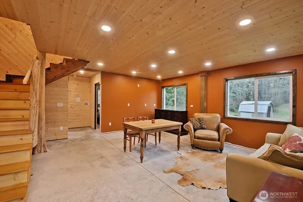 a bathroom with a toilet a sink and shower