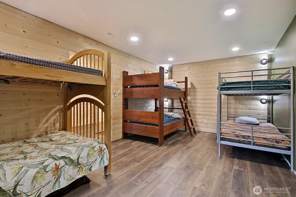 a living room with lots of furniture and clutter