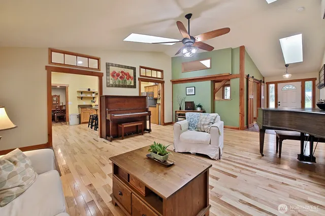a dining room with furniture window and wooden floor