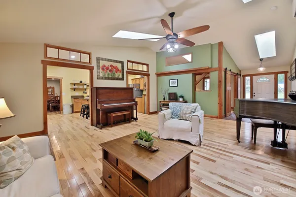 a kitchen with stainless steel appliances kitchen island granite countertop a refrigerator a stove and a sink with granite countertops