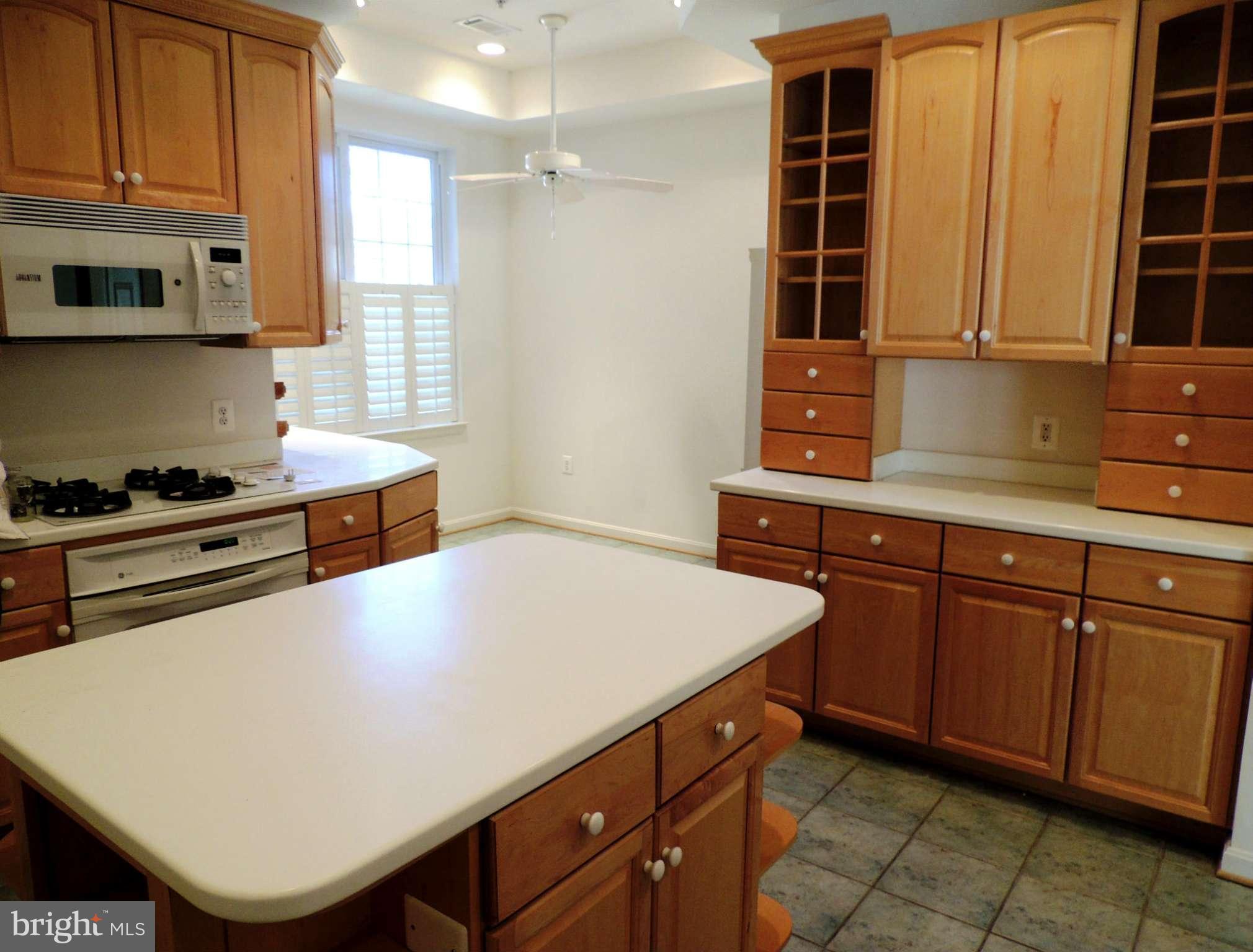 635 Runabout Loop, Unit 635 Solomons, MD 20688 - Photo 11 of 30 Kitchen with Island and Gas Cooking