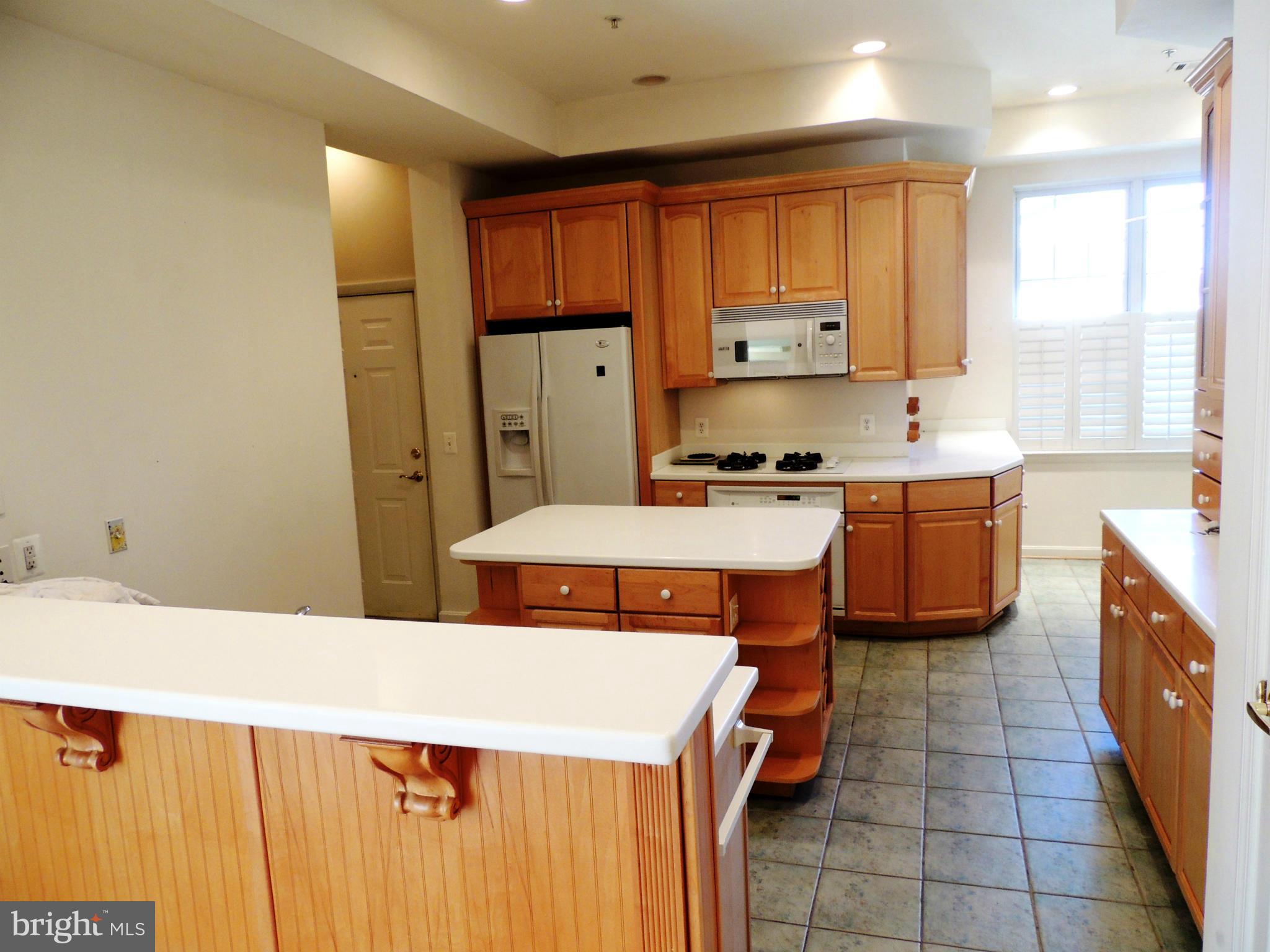 635 Runabout Loop, Unit 635 Solomons, MD 20688 - Photo 13 of 30 Kitchen with Corian surfaces and Ceramic Floors