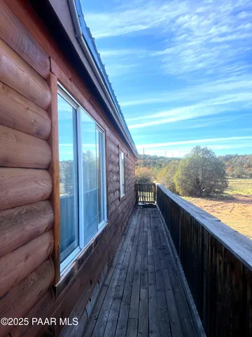 a view of balcony with wooden floor