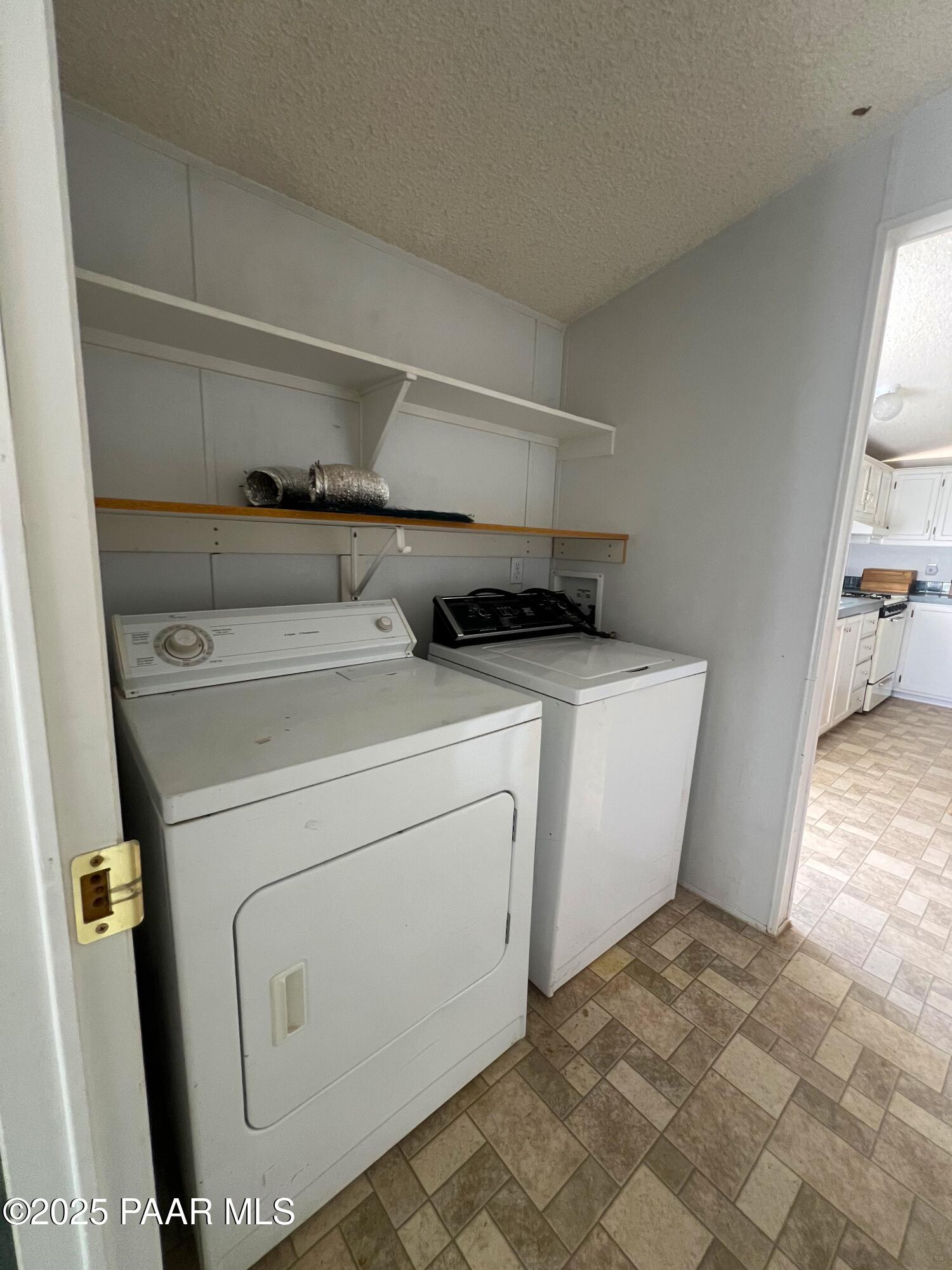0 Basconia Lane Seligman, AZ 86337 - Photo 13 of 28 a utility room with dryer and washer