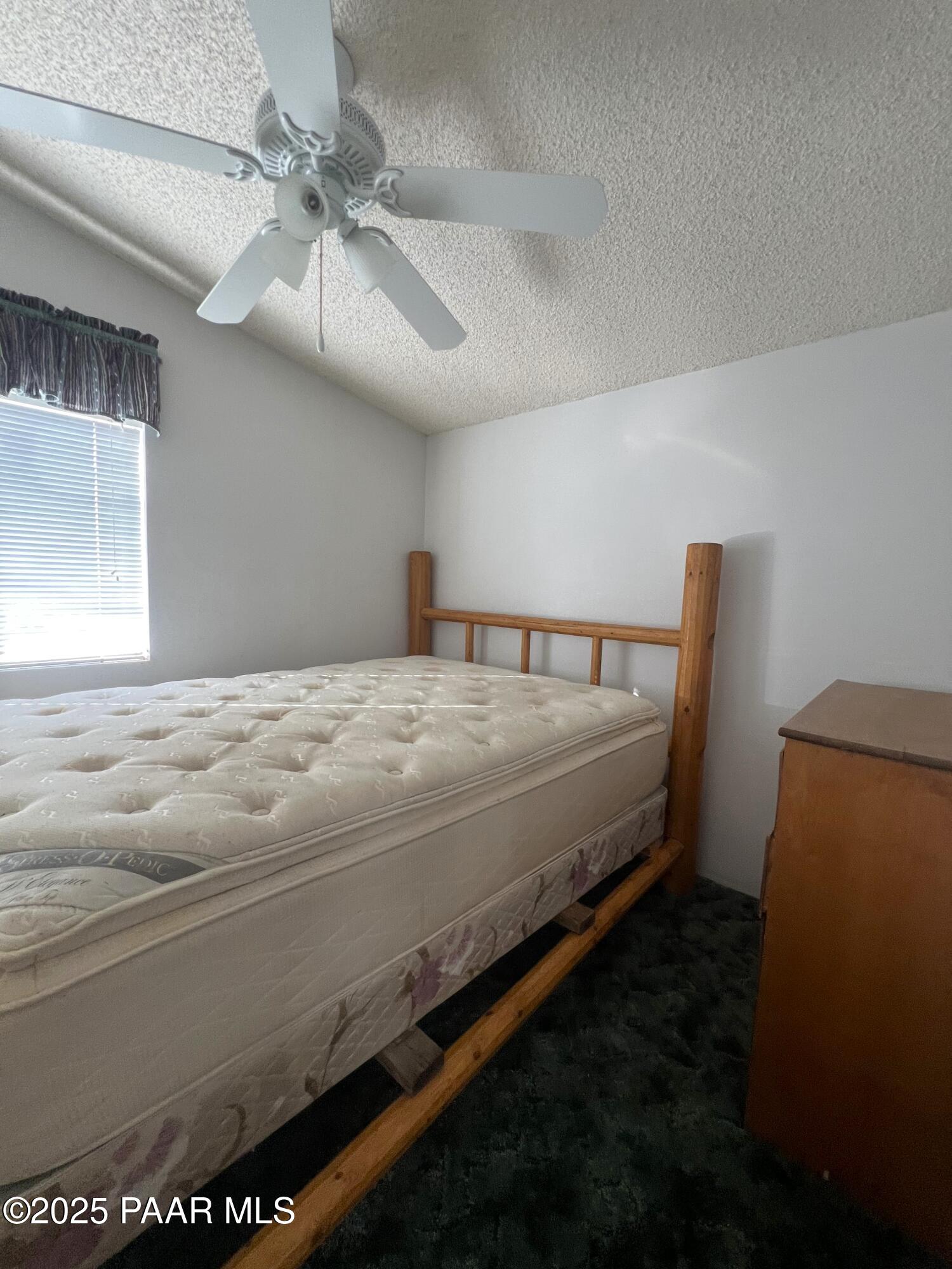 0 Basconia Lane Seligman, AZ 86337 - Photo 16 of 28 a bed sitting in a room next to a window